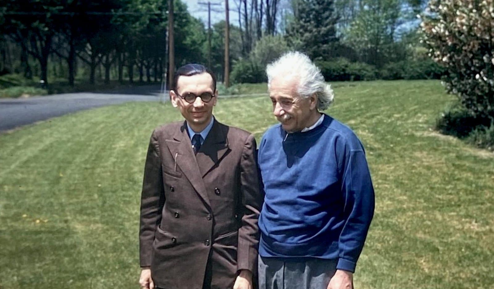 Kurt Gödel and Albert Einstein walking together at Princeton