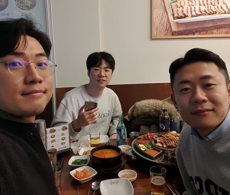 KB Kim and two friends at a Korean restaurant during the first startup days